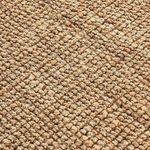 Close-up showing chunky boucle weave pattern and texture of natural jute fibers