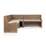 Frontal angle of banquette showing neat cushion alignment and woven rattan base