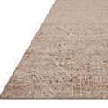 Close-up side angle showing the rug’s thickness and dimensional geometric weaving in oatmeal shades