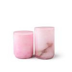 Smaller and larger pink alabaster canisters side by side on white background showing subtle color variation
