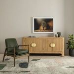 Chair arranged in a cozy living space with sectional and wood-beamed ceiling