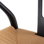 Dining chair with beige woven paper seat and black beech wood frame, modern curved backrest design