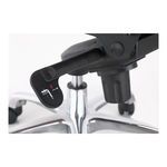 Close-up of black adjustment lever with white icons on polished chrome base and caster wheels