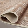 Folded Ari Natural Ivory Rug revealing tightly woven backside and fabric density.