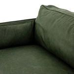 Close detail of leather piping and seam where back and side cushions meet