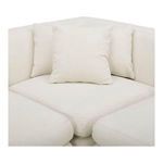 Close-up on corner seating area with three decorative back pillows in textured fabric