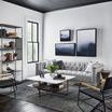 Mud cloth print pillows styled on a gray modern sofa in bright minimalist living room