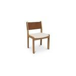 Three-quarter angle showing chair's rounded oak legs and side profile of fabric seat and leather backrest
