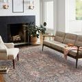 Rosemarie stone rug styled in a living room with beige furniture and modern decor