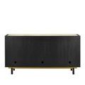 Side view showing woven raffia panel framed by black wood with gold accent detail near the leg