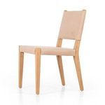 Villa Dining Chair angled to the right showing side profile of leather upholstery and wooden legs