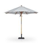 Back view of Baska umbrella showing the teak pole, cream canopy, and base
