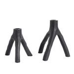 Pair of black cast iron candle holders showing size comparison between smaller and larger design