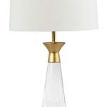 Close-up showing gold metal cap and the lower part of the lamp shade with clear crystal base