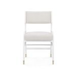 Front view of Tamara Arm Chair showing rectangular backrest and brass leg caps