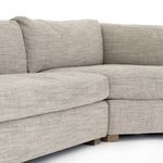Close-up on crisp corner where cushions meet at sectional inside angle, highlighting plushness