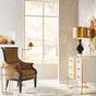 floor lamp shown in room setting beside leopard print armchair and window