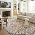 Sorrento Ivory rug styled in sunlit living room with modern beige sofa and wood floor