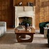 Similar room scene with Heritage Clay / Natural rug placed under a wooden coffee table, closer view from a different angle