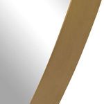 Detailed close-up of smooth gold finish on mirror frame edge