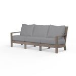 Laguna Sofa with hand-brushed aluminum frame mimicking driftwood and grey seat cushions