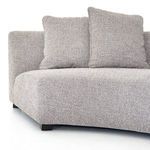 Sectional captured from a low angle highlighting fabric texture and block feet