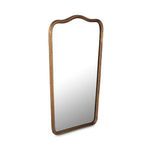 Keyes mirror viewed from left side at angle highlighting frame thickness and aged brass texture