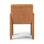 Rear view of Amur Dining Armchair displays smooth back panel and rounded top edge