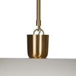 Close-up of brushed gold cylindrical fixture holding pendant shade