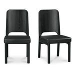 Set of two black Kerr dining chairs with high carved wood backs and padded vegan leather seats