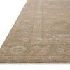 Close-up side angle showing low pile and detailed traditional pattern of the Louisa taupe gold rug