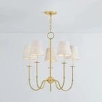 Amina Chandelier angled slightly to the right, showing the curves of the J-arms and linen shades softly illuminated
