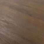 Macro shot capturing wood grain texture and subtle color variations on tabletop surface