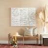 Paris Bench styled with pillows, sun hat, and colorful scarf in entryway setting with wall art