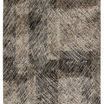 Abstract modern rug featuring black, taupe, gray, and cream moody hues with high-low textured pile