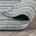 Folded section of Del Mar rug emphasizing thickness and natural fiber layers with striped pattern