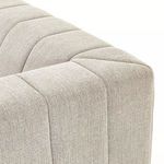 Close-up detail of stitching and fabric texture at the top edge of the sectional back