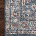 Close-up of rug corner on dark wooden floor highlighting dense texture and stitched edge