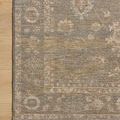 Top corner close-up of Louisa Lagoon rug pattern and colors on wooden floor