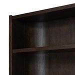 Close-up of top edge and shelf inside Lockhart Bookcase with dark rubbed oak grain detail