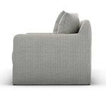 Side profile highlighting sofa's rounded arm and textured ash slipcover fabric