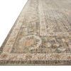 Low angled view showing the looped pile texture and thin edging in muted colors