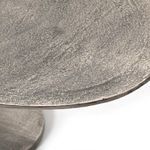 Close-up of elliptical tabletop edge with subtle signs of distress in finish