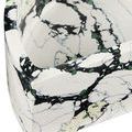 Detailed close-up emphasizing smooth curved interior and stone pattern blending white, black, green, and yellow