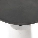 Close-up of grey hammered iron table surface with soft matte finish