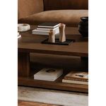 Repeating close-up view of tabletop with stacked books and rounded edges in warm oak finish