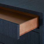 Open drawer showing natural wood interior contrasting with blue exterior