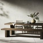 End view showing wide plank thickness and vertical grain of teak on table leg