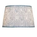 Lenore lamp shade lit from inside showing blue border trim and illuminated fabric pattern