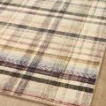 Close-up of vibrant plaid pattern with emphasis on intricate weave and colors